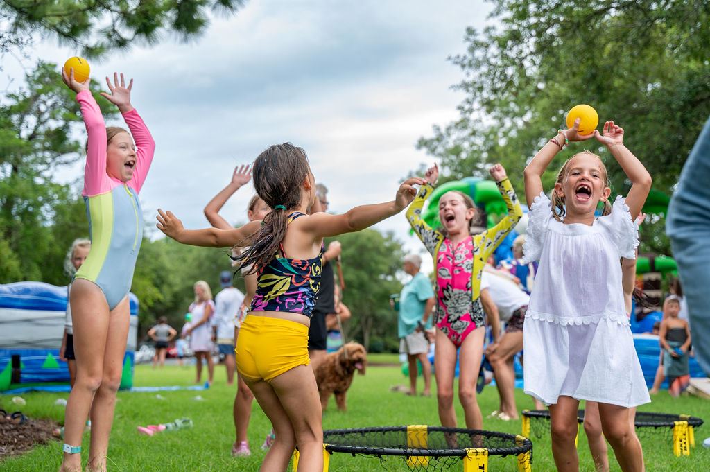 Girls playing spikeball